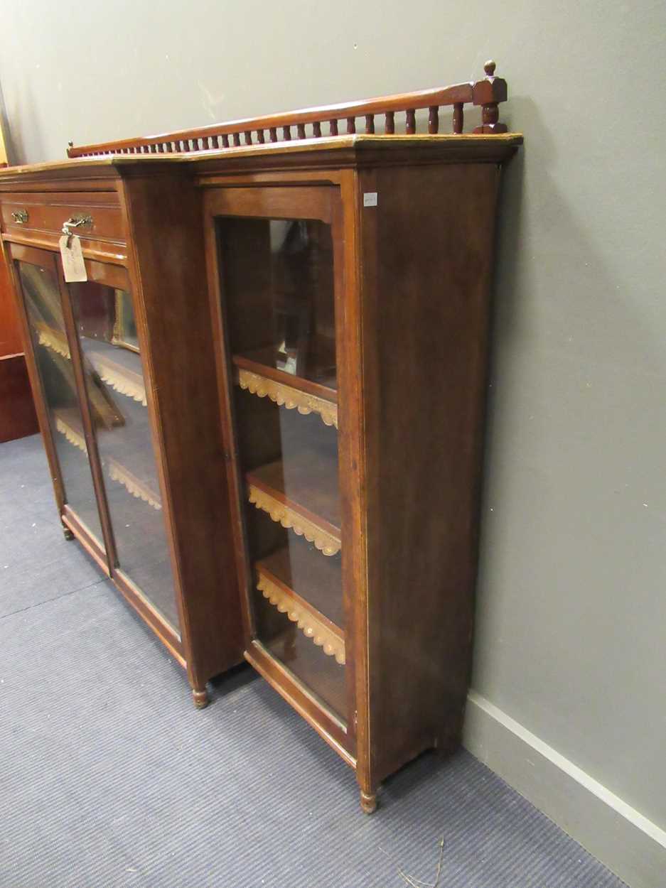 A late Victorian walnut glazed breakfront bookcase, stamped 'Garnett, Warrington', with spindle - Bild 9 aus 9