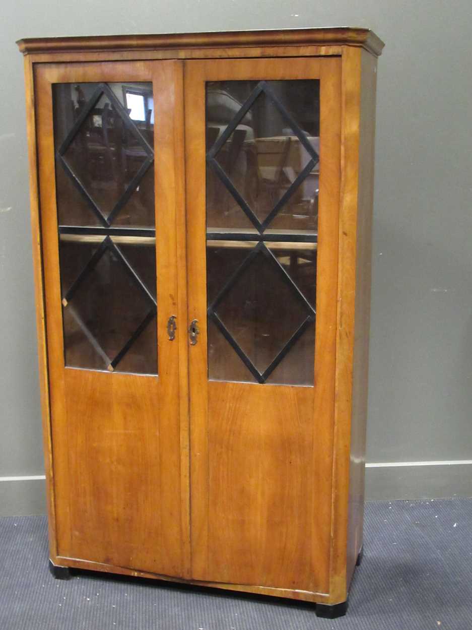 A two door Biedermeier book case, 163 x 99.5 x 44.5cmCondition report: Top is very scratched,