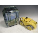 A sadler racing car teapot and a Doulton lambeth vase