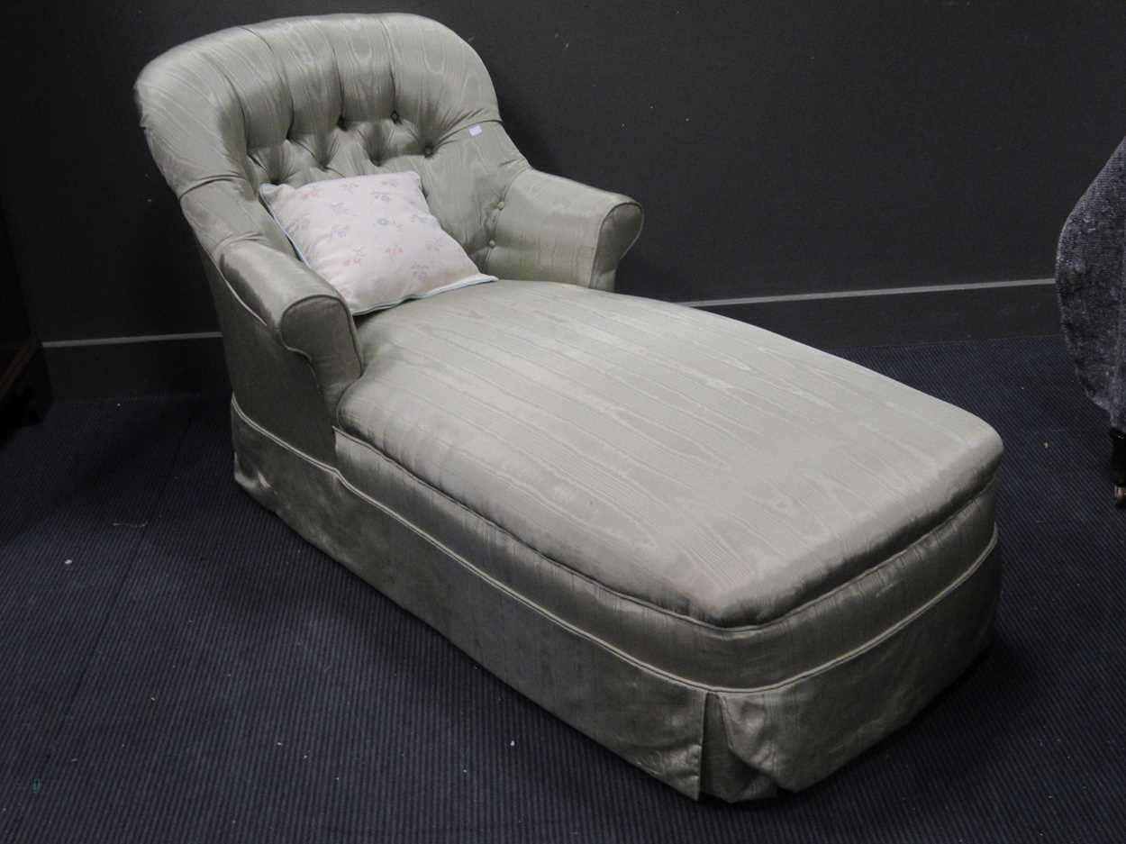 A day bed upholstered in green moire silk type fabric on altered legs 89 x 152 x 85cm