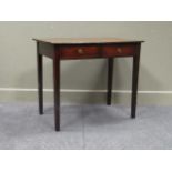 A George III mahogany sidetable the two frieze drawers over square tapering legs with reeded edge