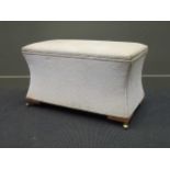 A Victorian style sarcophagus shape Ottoman on brass castors, 56 x 92 x 52cm