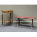 An early 20th century French walnut ocasional table with single drawer and lower tier and applied
