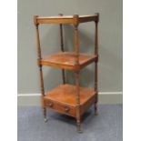 A 19th century mahogany three tier whatnot, ring turned supports, frieze drawers, 106cm high