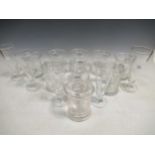 A set of 9 glass beer tankards and 5 ales flutes.