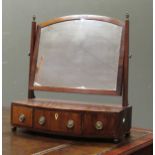 A 19th Century mahognamy toilet mirror with three drawer bow front base on ball feet 61.5cm wide.