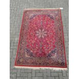 A kashan carpet 226 x 142cm