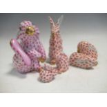 Four Herend red fishnet models of mice; a Herend pink fishnet model of a rabbit (5)