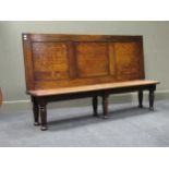 An oak settle, with a three panelled back, on turned legs, 100 x 170 x 39cm