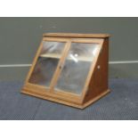 A fret carved ebonised corner shelf and a table top display cabinet (2)