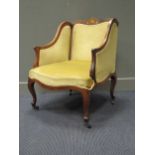 An Edwardian rosewood tub armchair with scallop inlaid cresting, on cabriole legs, 66cm wide