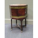 A late George mahogany octagonal cellaret, on stand, with later brass casters, 44cm wide