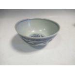 A Ming blue and white bowl, the exterior painted with three lions amongst scrolling vine and