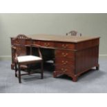 A George III style twin pedestal desk partners desk, the gilt tooled leather insert over sixteen