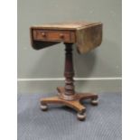 A 19th century mahogany work table with single end drawer upon a turned column support with a