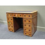 A late Victorian pedestal desk of small proportians, fitted eleven drawers (A/F), 74 x 98 x 58 cms