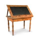 A walnut veneered architect’s table, mid-19th century,with adjustable rising top, on baluster turned