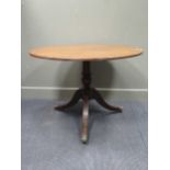 A Regency style reproduction mahogany and crossbanded circular breakfast table 75cm high and 106cm