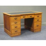 An Art Deco light oak twin pedestal desk of eight drawers (with key) 73.5 x 137.5 x 76cm