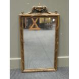 A late 19th century wall mirror, with giltwood urn and acanthus scroll cresting, 82cm high; and a