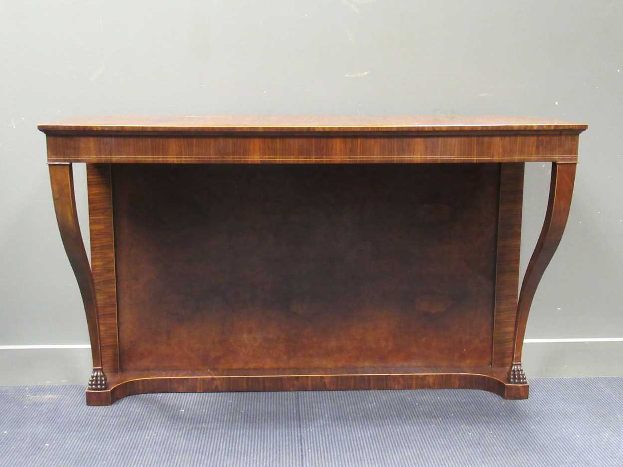 A Georgian style walnut consul table on lion paw carved foot supports 98 x 156 x 55.5cm