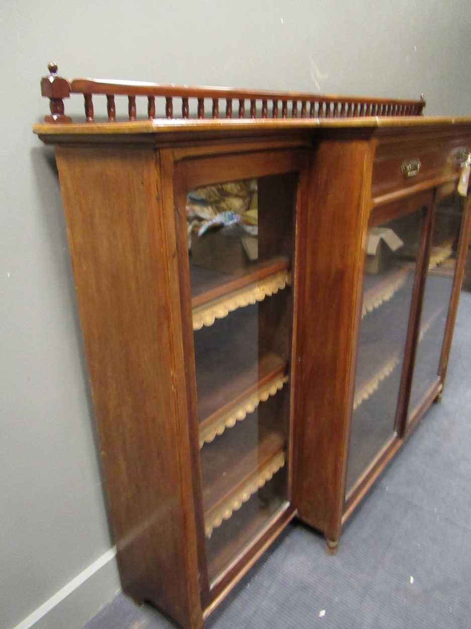 A late Victorian walnut glazed breakfront bookcase, stamped 'Garnett, Warrington', with spindle - Bild 6 aus 9