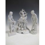 A 20th century German centrepiece with classical figures and two other figures all after the