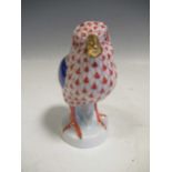 A Herend red fishnet model of a chick