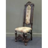 A Carolean style carved oak high back chair