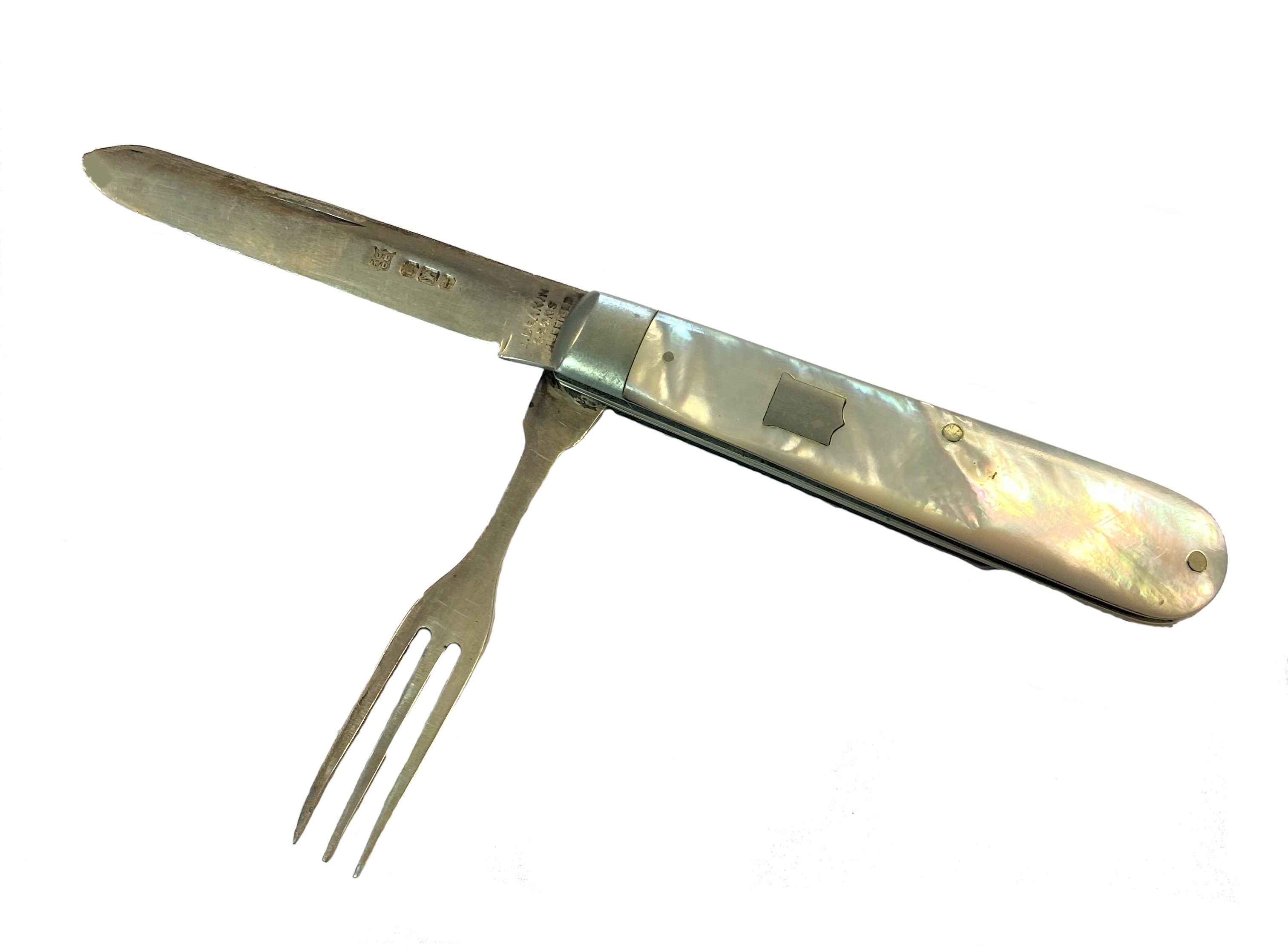 A Victorian silver 'campaign' style interlocking travelling fruit knife and fork,