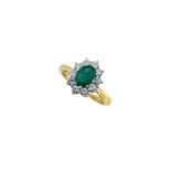 An emerald and diamond cluster ring,