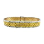 A late 20th century two colour gold brick link bracelet,