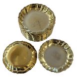 A set of eighteen 20th century Danish metalwares silver gilt coaster style ashtrays,