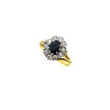 A late 20th century 18ct gold sapphire and diamond cluster ring,