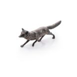 An early 20th century German metalwares silver table decoration in the form of a running fox,
