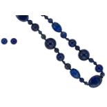 A lapis lazuli bead necklace and ear studs en suite,