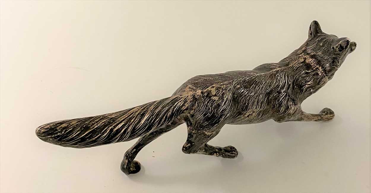 An early 20th century German metalwares silver table decoration in the form of a running fox, - Image 7 of 8