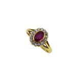 An 18ct gold ruby and diamond cluster ring,