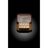 Cartier – A 9ct gold and diamond set Art Deco style travelling compact,