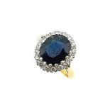 An 18ct gold sapphire and diamond cluster ring,