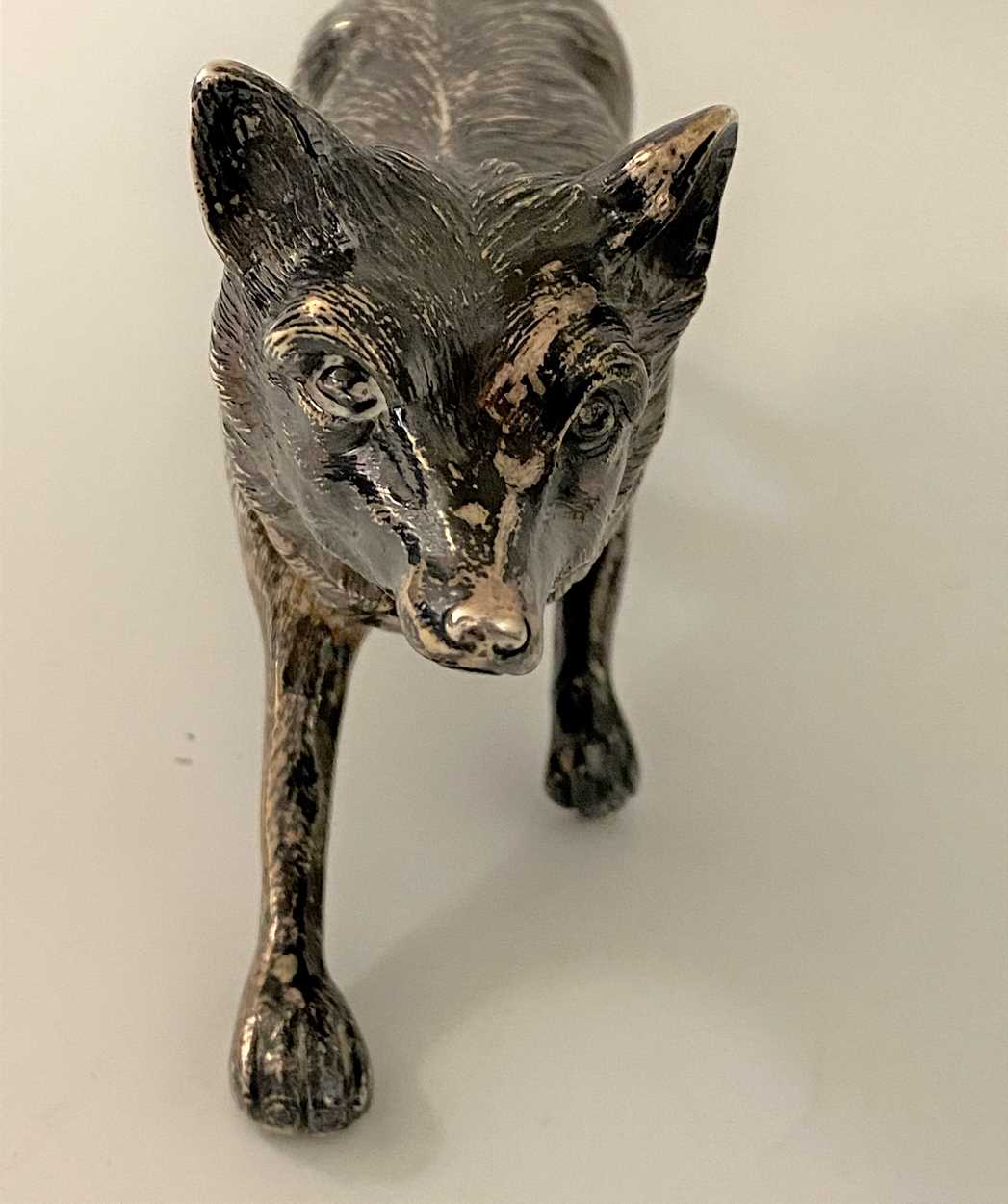 An early 20th century German metalwares silver table decoration in the form of a running fox, - Image 6 of 8