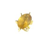A large oval citrine dress ring,