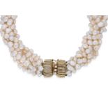 A pearl choker together with a pair of pearl ear clips,