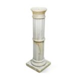 A fluted marble pedestal column,