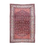 A red ground Feraghan carpet,