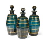 A set of three Bristol green glass decanters and stoppers, circa 1790-1800,