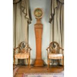 A waisted pine longcase clock in the neoclassical style,