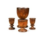A group of four fruitwood treen cups, 18th/19th century,