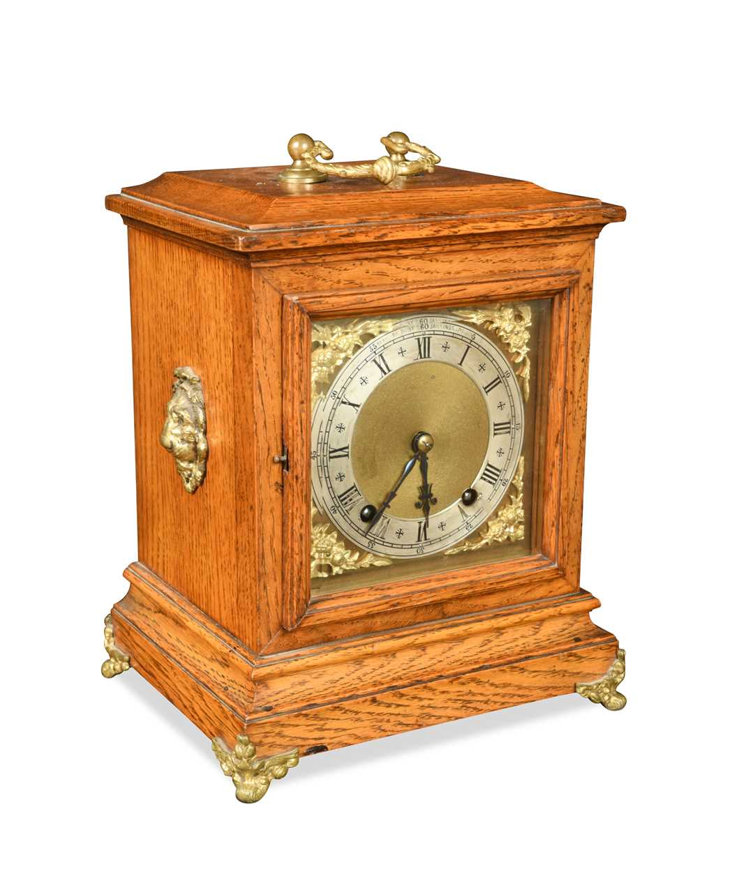 An oak case mantel clock, circa 1900,