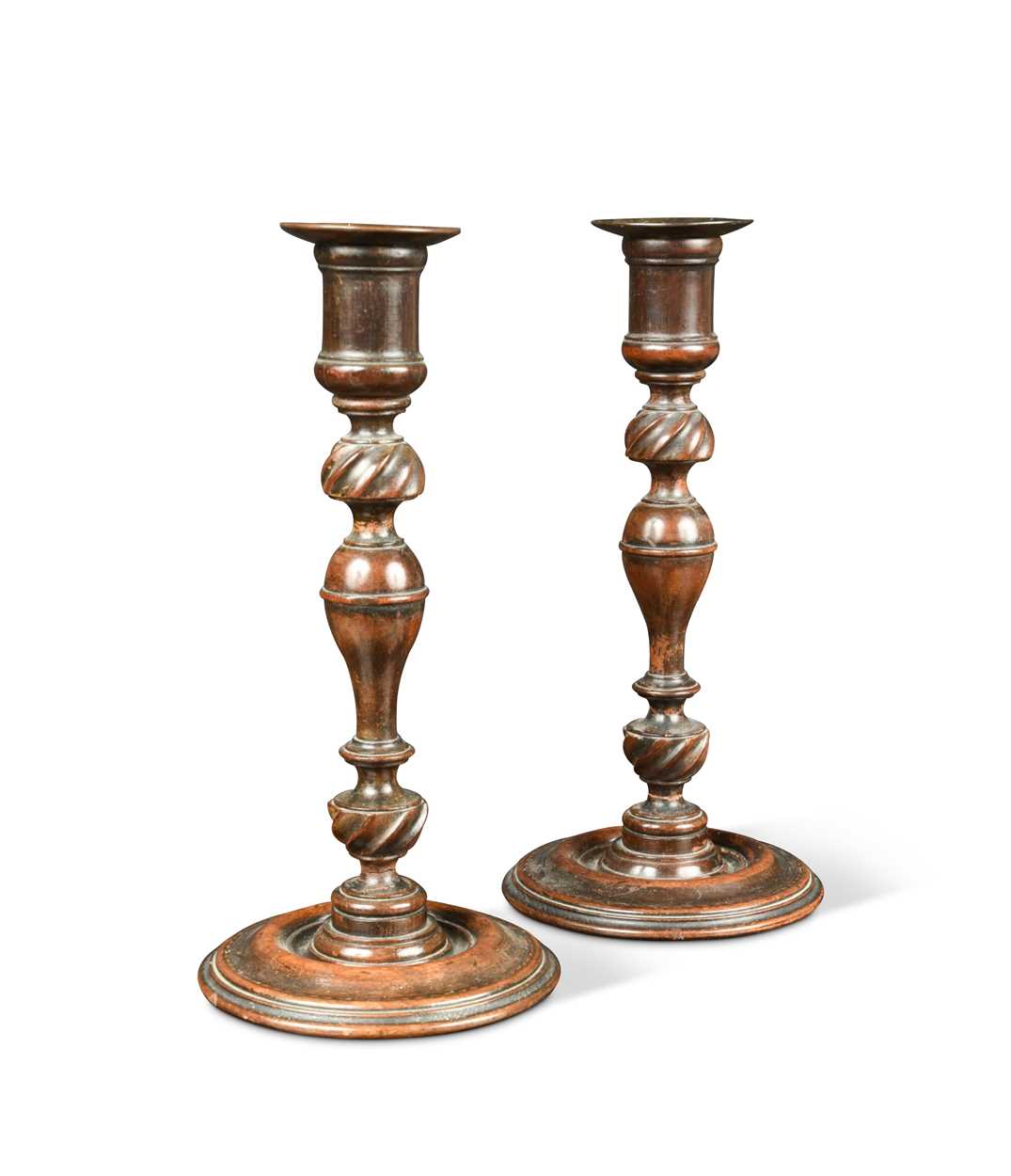 A pair of turned candlesticks, 19th century,